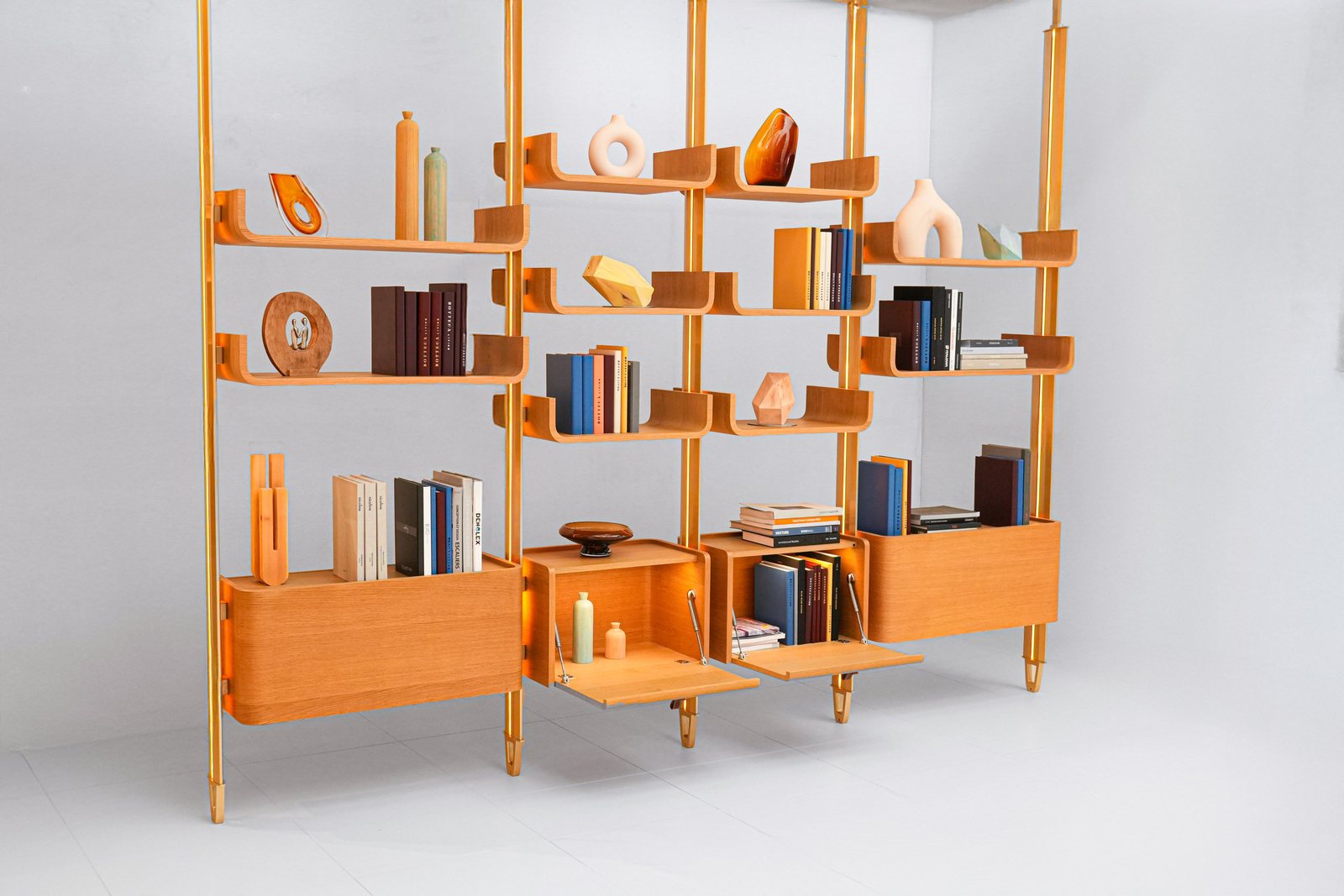 Krono Library: natural oak shelves and cabinets held between champagne poles